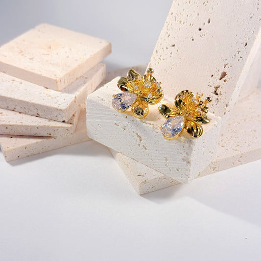 Gold flower stud earrings with sparkling gemstone center, summer nature jewelry